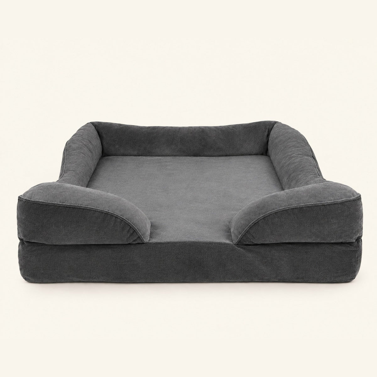 Cama antiestrés SORA en gris oscuro, vista de tres cuartos sobre fondo neutro